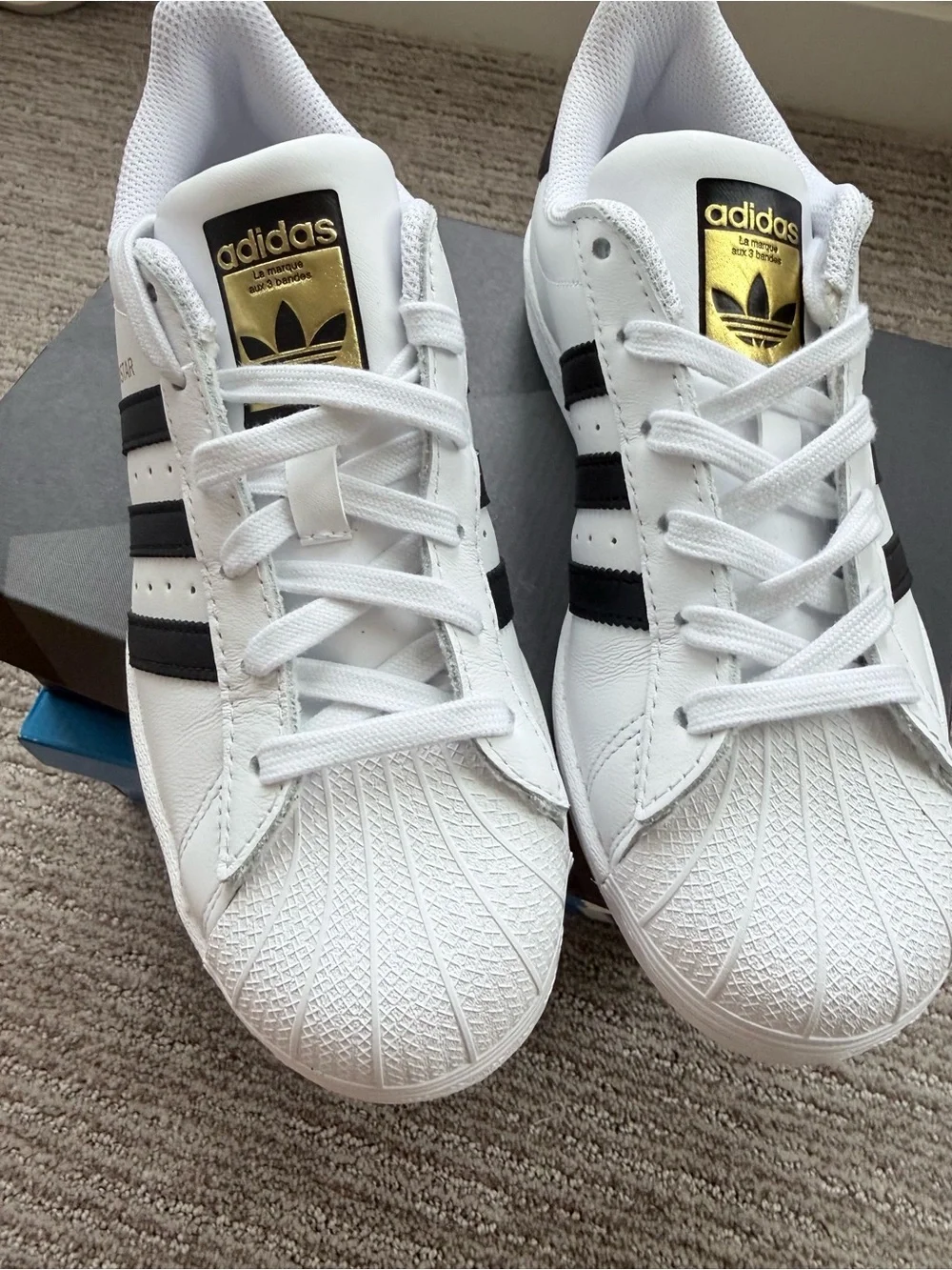 adidas White/Black Superstar Leather Sneaker with Gold Accents